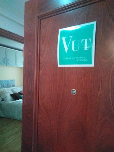 a door with a sign on it in a room at Cabañaquinta Senderista in Aller