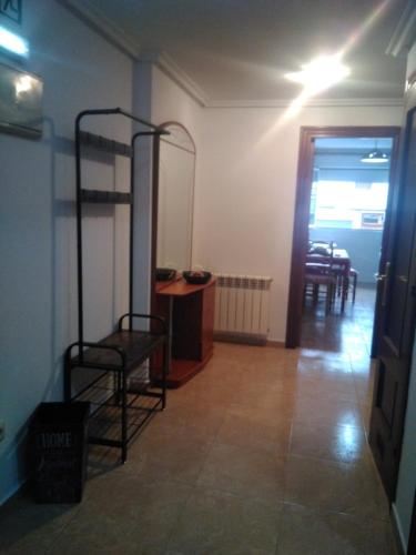 a room with two bunk beds and a table at Cabañaquinta Senderista in Aller