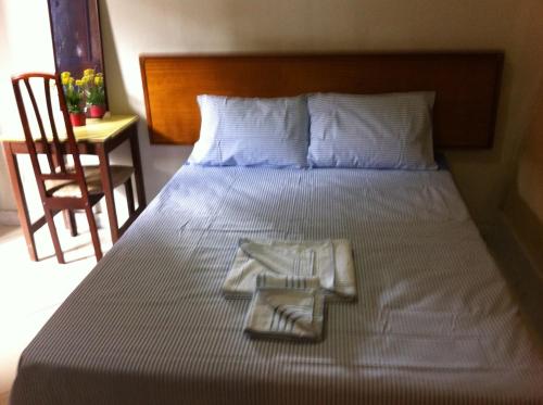 A bed or beds in a room at Pousada Del Rey