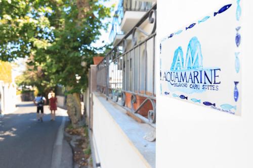 a sign for a marine wavering car service on a building at AQUAMARINE Relaxing Capri Suites in Capri
