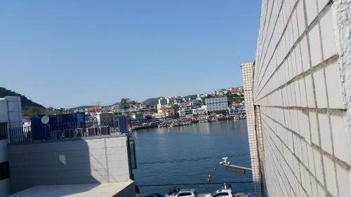 a view of a body of water with boats in it at Kangguan Guesthouse in Tongyeong
