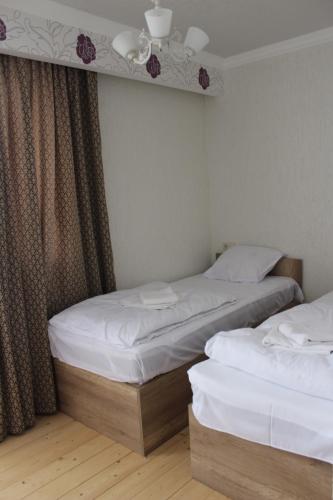 Postel nebo postele na pokoji v ubytování Ketino's Home