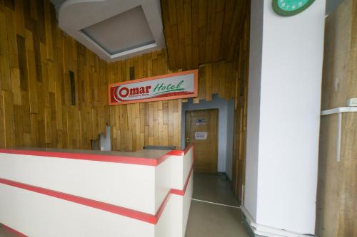 a sign on the wall of a building at RedDoorz Plus Syariah @ Pentadio Gorontalo in Gorontalo
