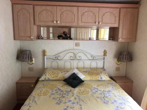 a person taking a picture of a bed in a bedroom at Lyndhurst 39 in Dunoon