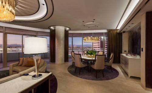 a dining room and living room with a table and chairs at The Darling at The Star Gold Coast in Gold Coast