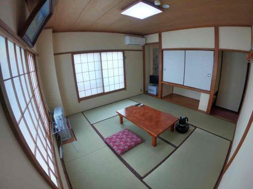 an overhead view of a room with a table and windows at Yuzawa Ski House in Yuzawa