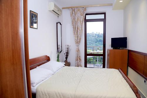 Un pat sau paturi într-o cameră la Apartments Ardura