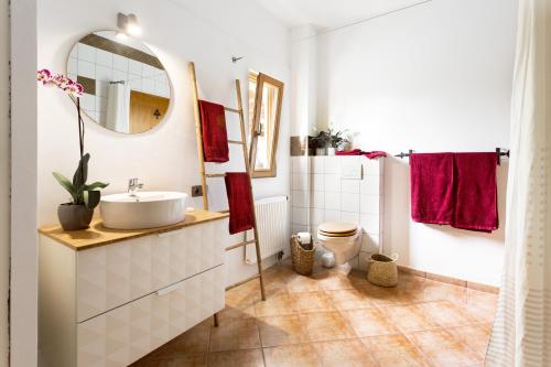a bathroom with a sink and a mirror at Finca Can Paulino in Llucmajor