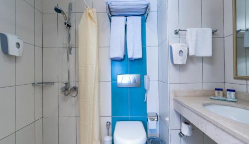 a bathroom with a shower with a toilet and a sink at Crystal Boutique Beach & Resort - Adult Only in Belek