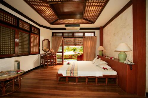 Badian Island Wellness Resort tesisinde bir odada yatak veya yataklar