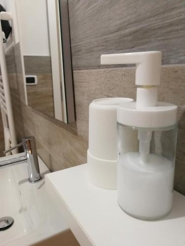 a bathroom with a white faucet on a sink at B&B Crispino in Belvedere Marittimo