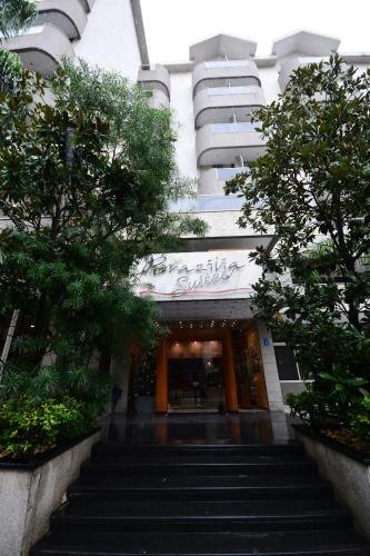 a building with stairs leading up to a building at Brazilia Suites Hotel in Baabda