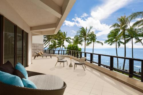 a view of the ocean from the balcony of a resort at Shangri-La Tanjung Aru, Kota Kinabalu in Kota Kinabalu