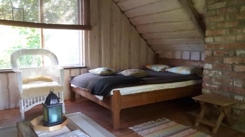 a bedroom with a bed in a attic at Kenni Holiday House in Kenni