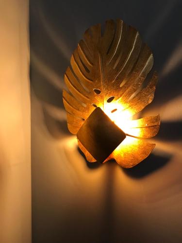 a lamp with a bird design on a wall at The Market House in Reading