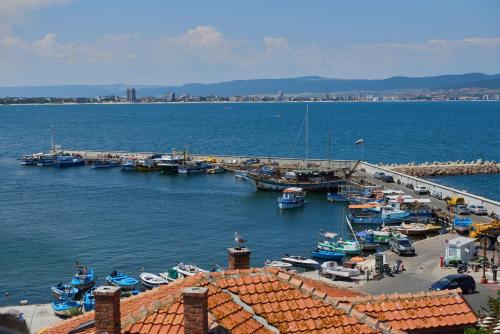 a group of boats docked at a dock in the water at Hotel Saint John Baptist Nessebar in Nesebar