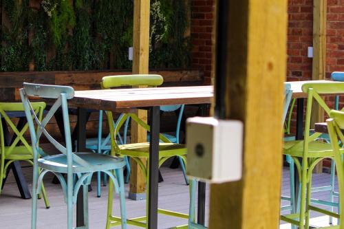 a wooden table and chairs on a patio at The Market House in Reading