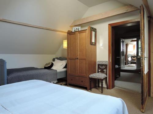 a hotel room with a bed and a bedroom at Drevenica Inga in Staré Hory