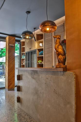 a kitchen with a statue of a chicken on a counter at Reverence Boutique Hotel in Varna City