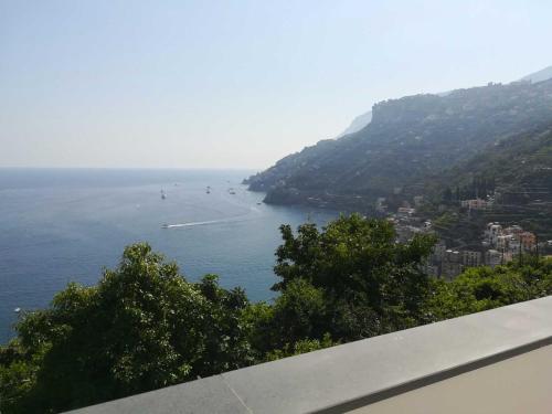 a view of a beach with people in the water at Torre Elisea in Minori