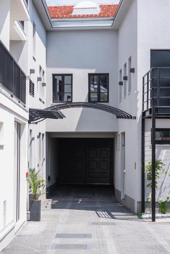 a garage with a large door in a building at Hotel Florian&Godler in Karlovac