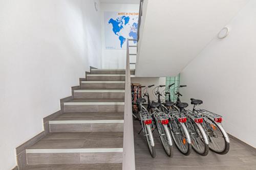 a row of bikes parked next to a staircase at HI Viseu - Pousada de Juventude in Viseu