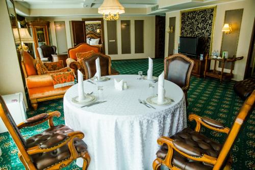 a dining room with a table and chairs at Diplomat Hotel by AG Hotels Group in Astana