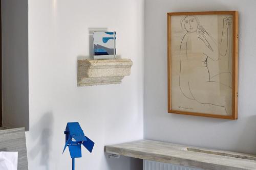 a drawing of a woman on a wall in a room at Nikolaou Art Residence in Aegina Town