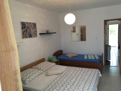 Katil atau katil-katil dalam bilik di Apartmani Roxy