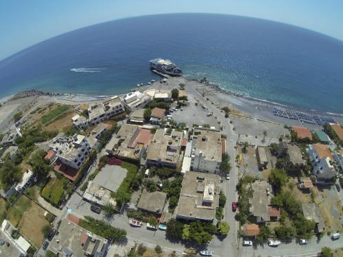 an aerial view of a beach with a cruise ship at Paralia guest house in Agia Roumeli
