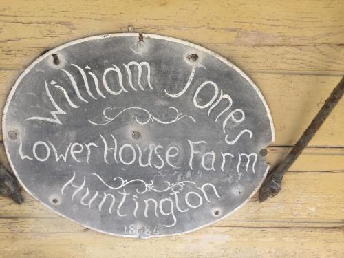 a metal sign that reads humanonga lower house farm imitation at Lower House Farm B&B, Herefordshire in Hergest