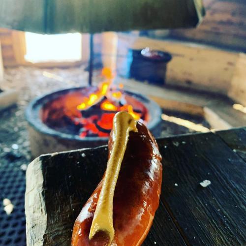 a hot dog sitting on top of a grill at Chalet Suomukka in Suomutunturi