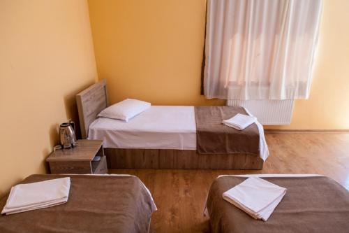 Postel nebo postele na pokoji v ubytování Hotel Old Borjomi