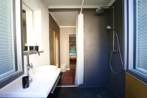 a bathroom with a sink and a shower at CasaKarita in Forstern
