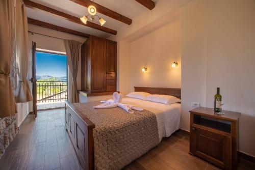 a bedroom with a bed with a towel on it at Villa Old Castle Apartments in Kotor