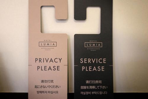 a ribbon with the letter h on top of it at Hotel Lumia Myeongdong in Seoul