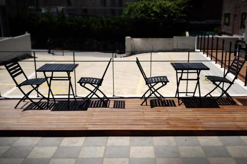 a group of chairs and a table on a patio at Hotel Lumia Myeongdong in Seoul