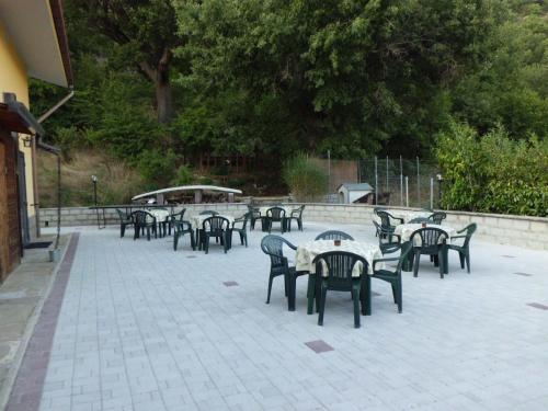 a group of tables and chairs on a patio at Casetta dei "Prati" in Vaglio di Basilicata