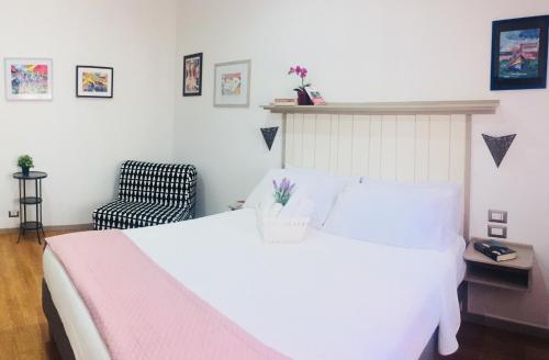 Postel nebo postele na pokoji v ubytování Starnone Bed&Book
