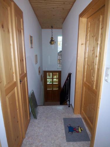 a hallway with a door leading to a room at Apartments Haus Steinbock in Tauplitz