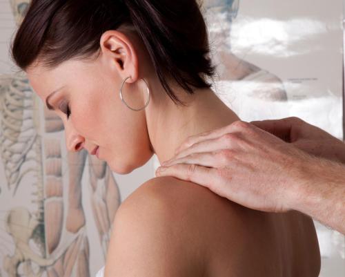 a woman with her back pain with a man at Hotel Paris in Mariánské Lázně