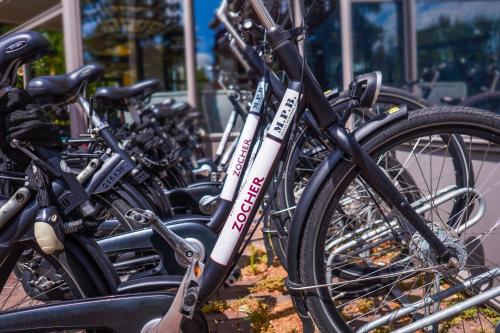 a row of bikes parked next to each other at Carlton Square Hotel in Haarlem