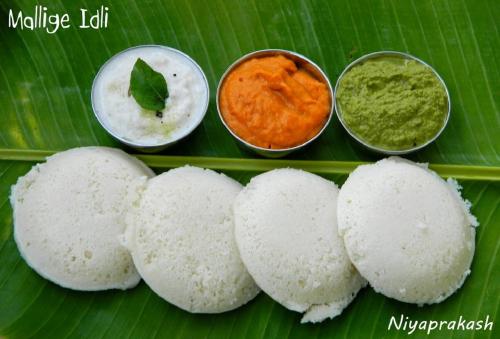 a group of white food on a green leaf at Nestlay Rooms Vanagaram in Chennai