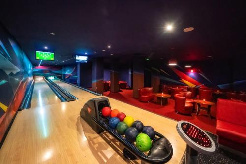 a bowling lane with balls in a bowling alley at Hotel Tatra in Zakopane