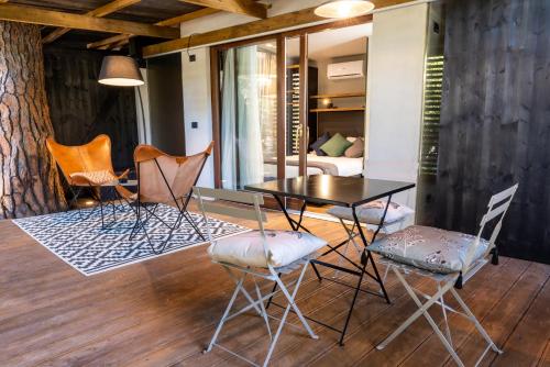 a dining room with a table and chairs at Camping Village Santapomata in Castiglione della Pescaia