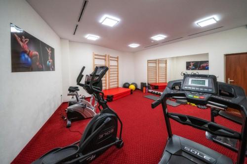 a gym with two tread machines and a treadmill at Hotel Tatra in Zakopane