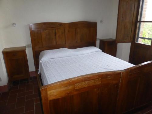 Ένα ή περισσότερα κρεβάτια σε δωμάτιο στο Agriturismo Le Tre Pietre - Podere nel Chianti