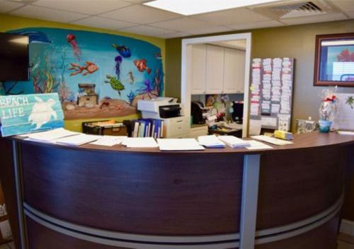 an office with a desk with a counter top at Sands Beach Club in Myrtle Beach