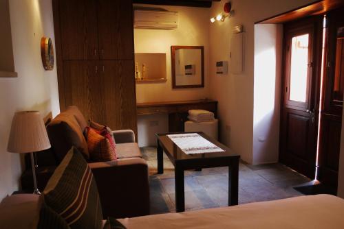 a living room with a couch and a coffee table at To Kastri in Kalopanayiotis