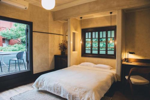 Postel nebo postele na pokoji v ubytování Guesthouse toco